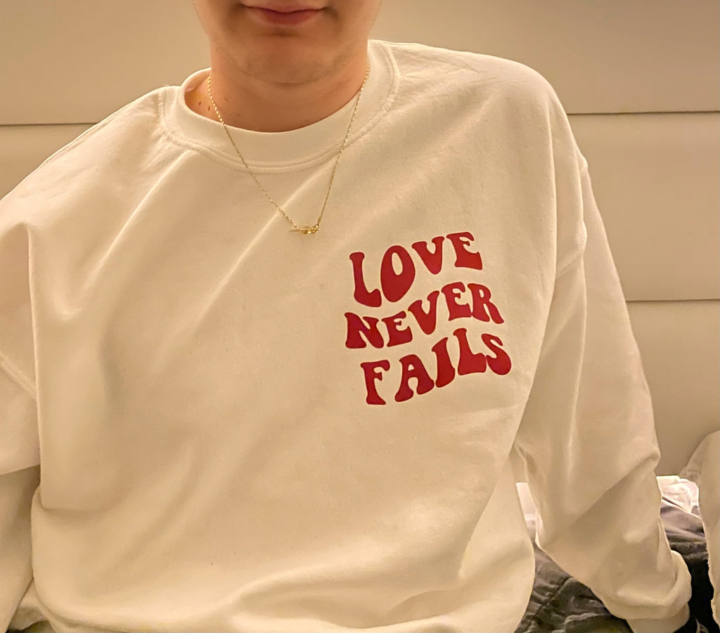 Love never fails | sweatshirt - Apparel for God LLC